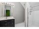 Bathroom featuring a vanity with a solid surface countertop and glass door shower at 4341 Horder Ct, Snellville, GA 30039