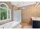 Elegant bathroom with a bathtub and glass door shower at 4341 Horder Ct, Snellville, GA 30039
