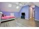 Bedroom features wood floors, a ceiling fan, skylights and vaulted ceiling at 4341 Horder Ct, Snellville, GA 30039