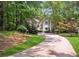 View of a charming home nestled in lush greenery, offering a private and serene setting at 4341 Horder Ct, Snellville, GA 30039