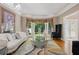 Elegant living room with plush seating, decorative lighting, and hardwood floors creates a cozy and inviting space at 4341 Horder Ct, Snellville, GA 30039