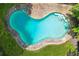 Aerial view of an in-ground backyard swimming pool surrounded by a concrete deck at 4341 Horder Ct, Snellville, GA 30039