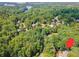 Expansive aerial view of wooded home site with lake access and mature trees at 2505 Ridgehurst Dr, Buford, GA 30518