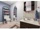 Bathroom with decorative mirror, sink, and mosaic tile backsplash at 2505 Ridgehurst Dr, Buford, GA 30518