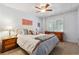 Bedroom with neutral carpet, white walls, window, and warm-toned decor at 2505 Ridgehurst Dr, Buford, GA 30518