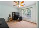 Study or home office with window, computer desk, and comfortable office chair at 2505 Ridgehurst Dr, Buford, GA 30518
