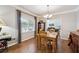 Traditional dining room with wood table, chandelier, and natural light at 2505 Ridgehurst Dr, Buford, GA 30518