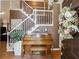 Inviting foyer features a grand staircase, hardwood floors, and a vintage piano at 2505 Ridgehurst Dr, Buford, GA 30518