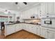 Well-equipped kitchen with white cabinets, granite countertops, and stainless steel appliances at 2505 Ridgehurst Dr, Buford, GA 30518