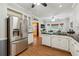 Spacious kitchen with stainless steel appliances, granite countertops and wood floors at 2505 Ridgehurst Dr, Buford, GA 30518