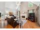 Bright living room with a fireplace, vaulted ceilings, and hardwood floors at 2505 Ridgehurst Dr, Buford, GA 30518