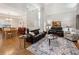 Open-concept living room with hardwood floors and stylish furnishings at 2505 Ridgehurst Dr, Buford, GA 30518