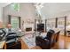 Cozy living room with fireplace, high ceilings, and hardwood floors at 2505 Ridgehurst Dr, Buford, GA 30518