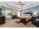 Spacious bedroom featuring a tray ceiling, neutral palette, and comfortable furnishings at 2505 Ridgehurst Dr, Buford, GA 30518
