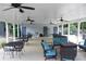 Spacious covered patio area with comfortable seating, ceiling fans, and outdoor gathering space at 2505 Ridgehurst Dr, Buford, GA 30518