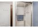 Shower with glass sliding doors and a view of the wall-mounted towel hooks at 2505 Ridgehurst Dr, Buford, GA 30518
