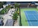 Aerial view of the patio, tennis court, and surrounding landscaping at 3445 Stratford Rd # 3102, Atlanta, GA 30326