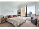 Comfortable bedroom with ample natural light and city views, enhanced by neutral decor at 3445 Stratford Rd # 3102, Atlanta, GA 30326