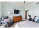 Spacious bedroom featuring modern decor, a cozy chair, and exercise equipment at 3445 Stratford Rd # 3102, Atlanta, GA 30326
