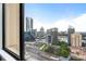 Stunning city view through a large window showcases nearby architecture and an expansive sky at 3445 Stratford Rd # 3102, Atlanta, GA 30326