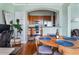 Inviting dining area with a wooden table, modern chairs, and an open view to the kitchen area at 3445 Stratford Rd # 3102, Atlanta, GA 30326