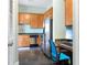 Modern kitchen with stainless steel appliances, wooden cabinets, and a built-in desk area at 3445 Stratford Rd # 3102, Atlanta, GA 30326