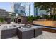 Outdoor lounge featuring lounge chairs around a fire pit and Paramount sign with city view at 3445 Stratford Rd # 3102, Atlanta, GA 30326
