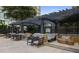 Relaxing outdoor lounging area featuring multiple lounge chairs under a pergola nearby the pool at 3445 Stratford Rd # 3102, Atlanta, GA 30326