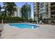 A beautiful outdoor swimming pool featuring plenty of lounge chairs with skyscrapers in the background at 3445 Stratford Rd # 3102, Atlanta, GA 30326
