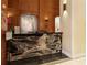 Reception area featuring a dark marbled desk with wood decor and glass doors in the background at 3445 Stratford Rd # 3102, Atlanta, GA 30326