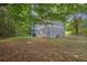 Large backyard featuring mature trees and a grassy area, providing ample space for outdoor activities and relaxation at 3498 Newberry Trl, Decatur, GA 30034