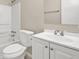 Bathroom featuring a toilet, bathtub and vanity with ample lighting and mirror at 3498 Newberry Trl, Decatur, GA 30034