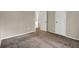 Bedroom with carpet, closet and a hallway with a glimpse into an adjacent room at 3498 Newberry Trl, Decatur, GA 30034