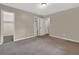 Spacious bedroom features carpet flooring, a neutral color palette, and two closets at 3498 Newberry Trl, Decatur, GA 30034