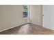 This bedroom features neutral colored walls, carpet, and a sunny window view at 3498 Newberry Trl, Decatur, GA 30034