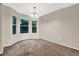 Bright dining area featuring a bay window and a modern chandelier at 3498 Newberry Trl, Decatur, GA 30034