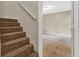 Carpeted stairs lead to a bedroom, offering a glimpse into the carpeted space at 3498 Newberry Trl, Decatur, GA 30034