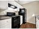 Functional kitchen with black appliances, white cabinetry, and durable countertops at 3498 Newberry Trl, Decatur, GA 30034