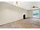 Spacious living room with a traditional fireplace and large windows at 3498 Newberry Trl, Decatur, GA 30034