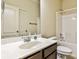 Clean bathroom featuring a tub-shower combo with white tile, a modern vanity, and a large mirror at 680 Emeril Dr, Avondale Estates, GA 30002