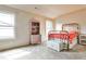 Bright bedroom with carpet, neutral paint, white wicker furniture and two windows at 680 Emeril Dr, Avondale Estates, GA 30002