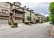 Charming townhome complex featuring neutral exteriors, private garages, and inviting front porches and decks at 680 Emeril Dr, Avondale Estates, GA 30002
