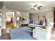 Open-concept living room with hardwood floors, open to dining and kitchen at 680 Emeril Dr, Avondale Estates, GA 30002