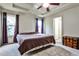 Comfortable primary bedroom featuring tray ceiling, neutral paint, carpet and two windows at 680 Emeril Dr, Avondale Estates, GA 30002