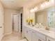 Bathroom features double sinks, white cabinets, and a separate shower, perfect for a growing Gathering at 230 Mackenzie Ct, Covington, GA 30016