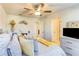Cozy bedroom features a ceiling fan, comfortable bed, and is decorated with tasteful accent pieces at 230 Mackenzie Ct, Covington, GA 30016