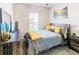 Cozy bedroom with rustic furniture, soft bedding, and natural light for a relaxing retreat at 230 Mackenzie Ct, Covington, GA 30016
