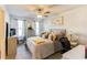 Comfortable bedroom featuring a ceiling fan, natural light, and cozy decor creating a peaceful retreat at 230 Mackenzie Ct, Covington, GA 30016