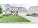 Beautiful two-story home with a well-manicured lawn and a two-car garage, offering curb appeal at 230 Mackenzie Ct, Covington, GA 30016