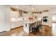 Bright kitchen with an island, modern stainless appliances, white cabinetry, and pendant lighting at 230 Mackenzie Ct, Covington, GA 30016